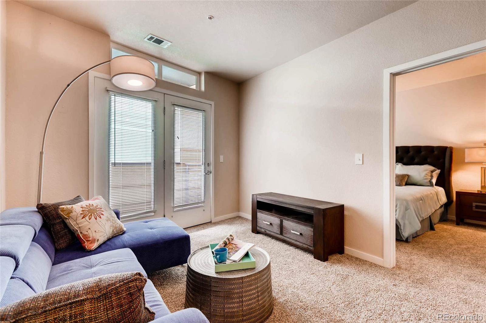 3101 Blake Street, Unit 214 Denver, CO 80205 - Photo 5 of 17 a living room with furniture and a large window