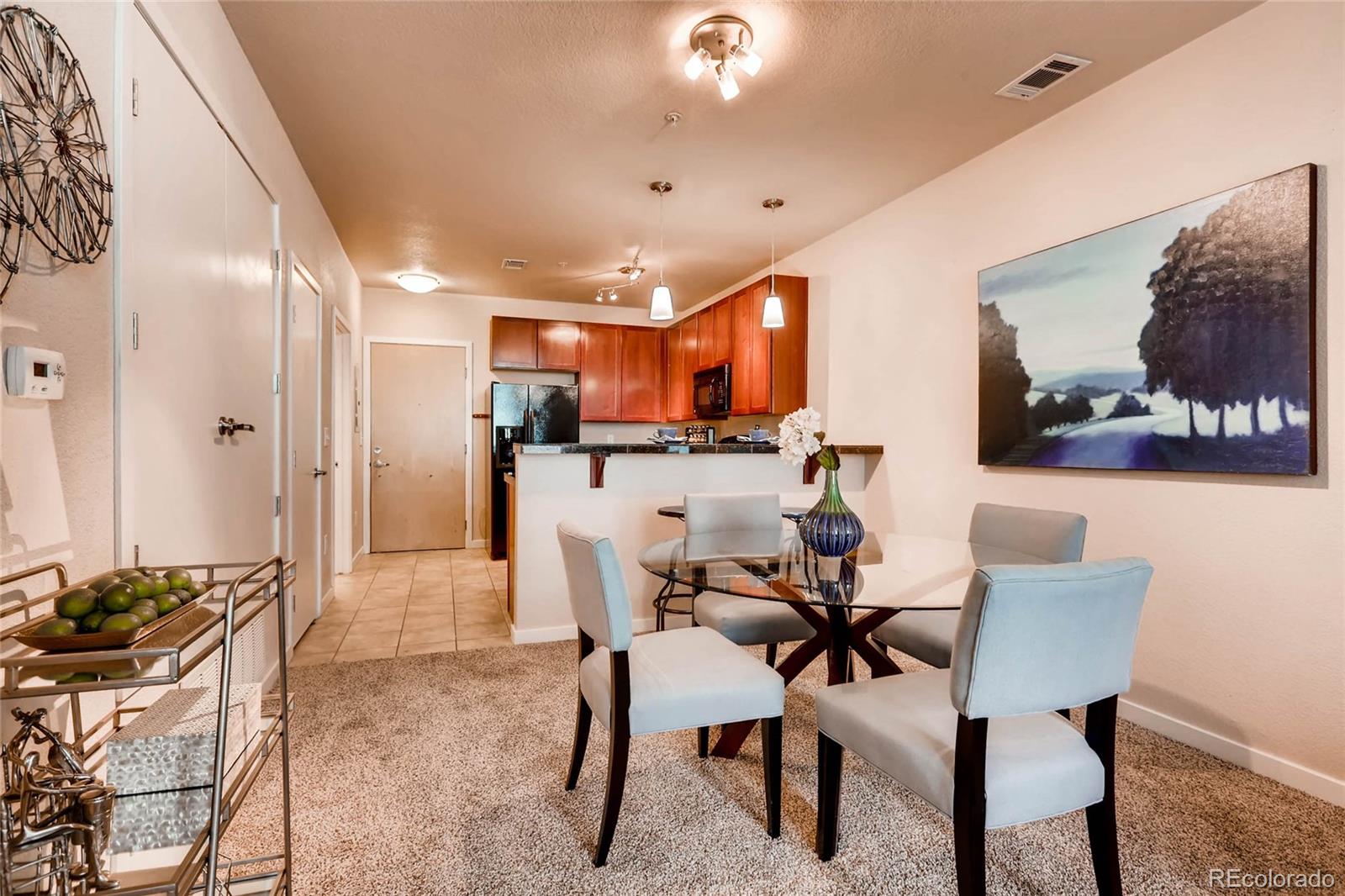 3101 Blake Street, Unit 214 Denver, CO 80205 - Photo 6 of 17 a view of a dining room with furniture