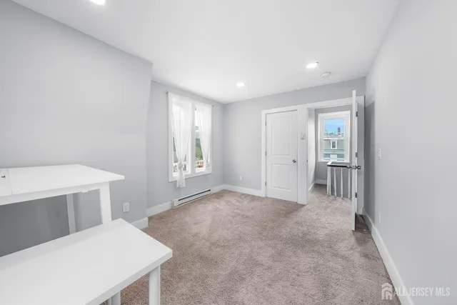 a view of livingroom with hardwood floor and cabinet