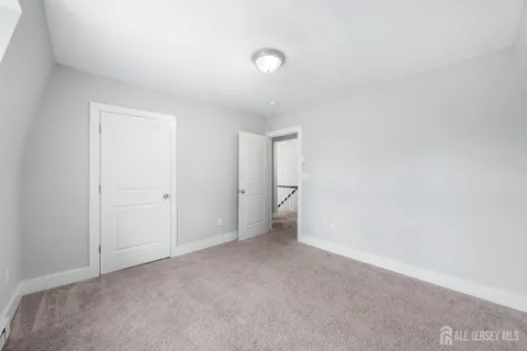 a view of an empty room and a window