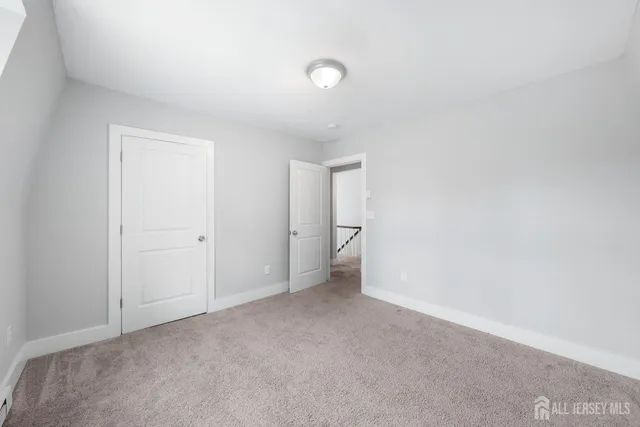 a view of an empty room and a window