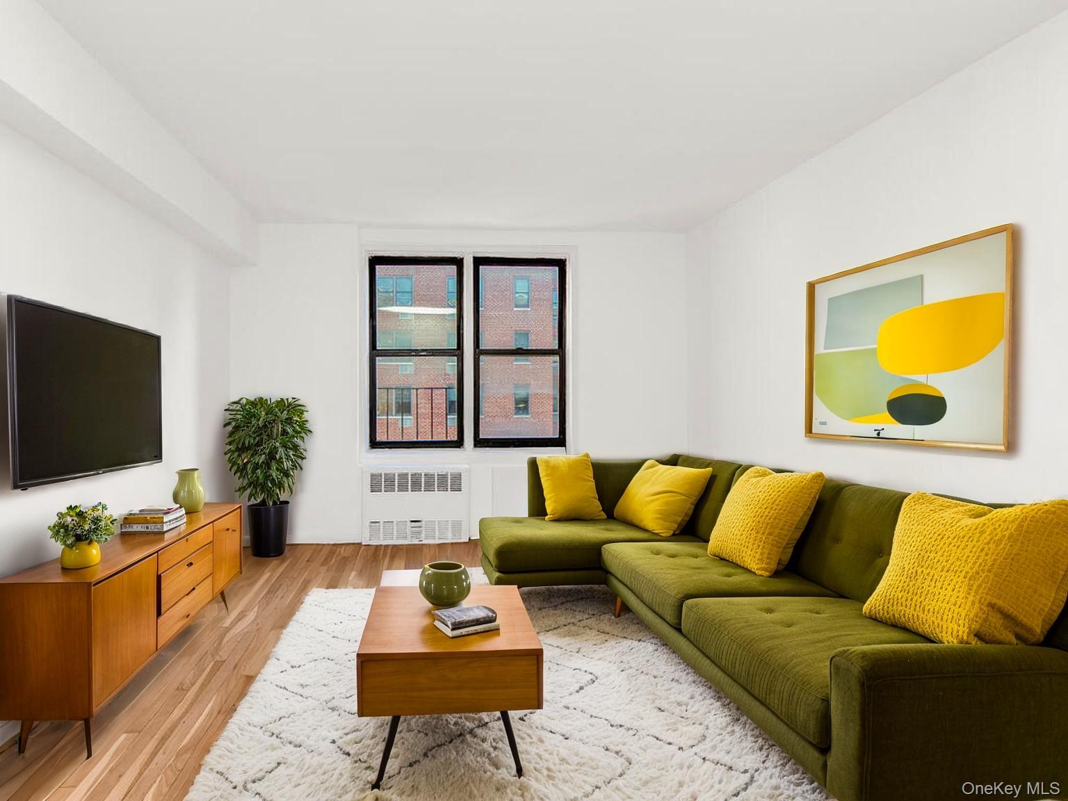 2165 Matthews Avenue, Unit 4A Bronx, NY 10462 - Photo 8 of 23 a living room with furniture and a flat screen tv