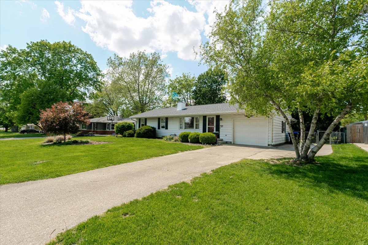 302 Radliff Road Bloomington, IL 61701 - Photo 2 of 35 a front view of a house with a garden