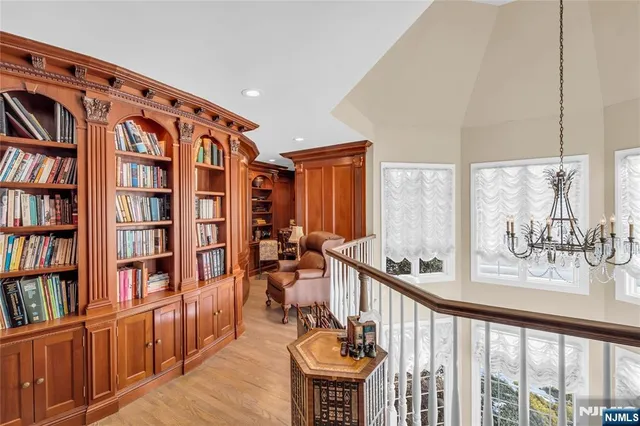 a bathroom with a granite countertop sink toilet a mirror and shower