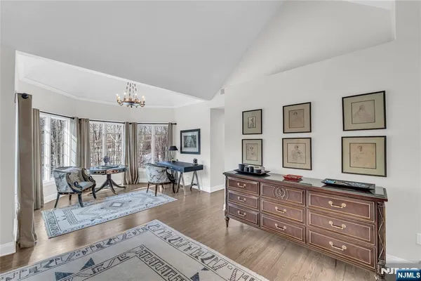 a living room with furniture and large windows