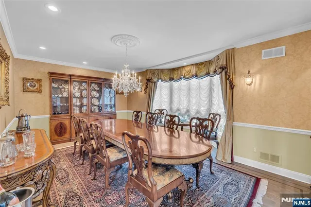 a kitchen with granite countertop lots of counter top space a sink stainless steel appliances and cabinets