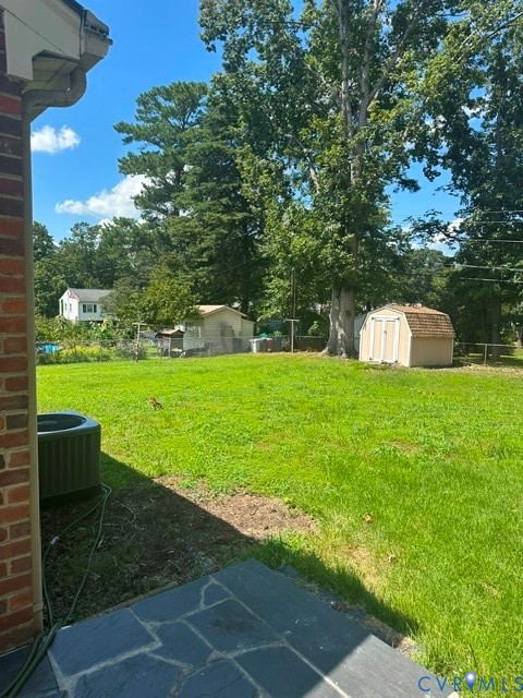 7806 Dasher Road Henrico, VA 23294 - Photo 3 of 14 Expansive lawn with mature trees and a storage she