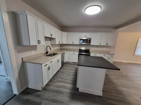 a view of cabinets and wooden floor