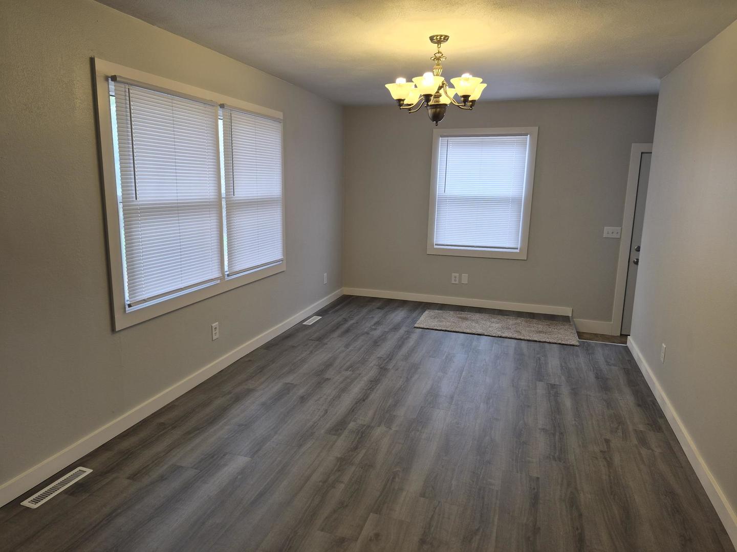 101 North 6th Avenue New Windsor, IL 61465 - Photo 15 of 33 wooden floor in an empty room with a window