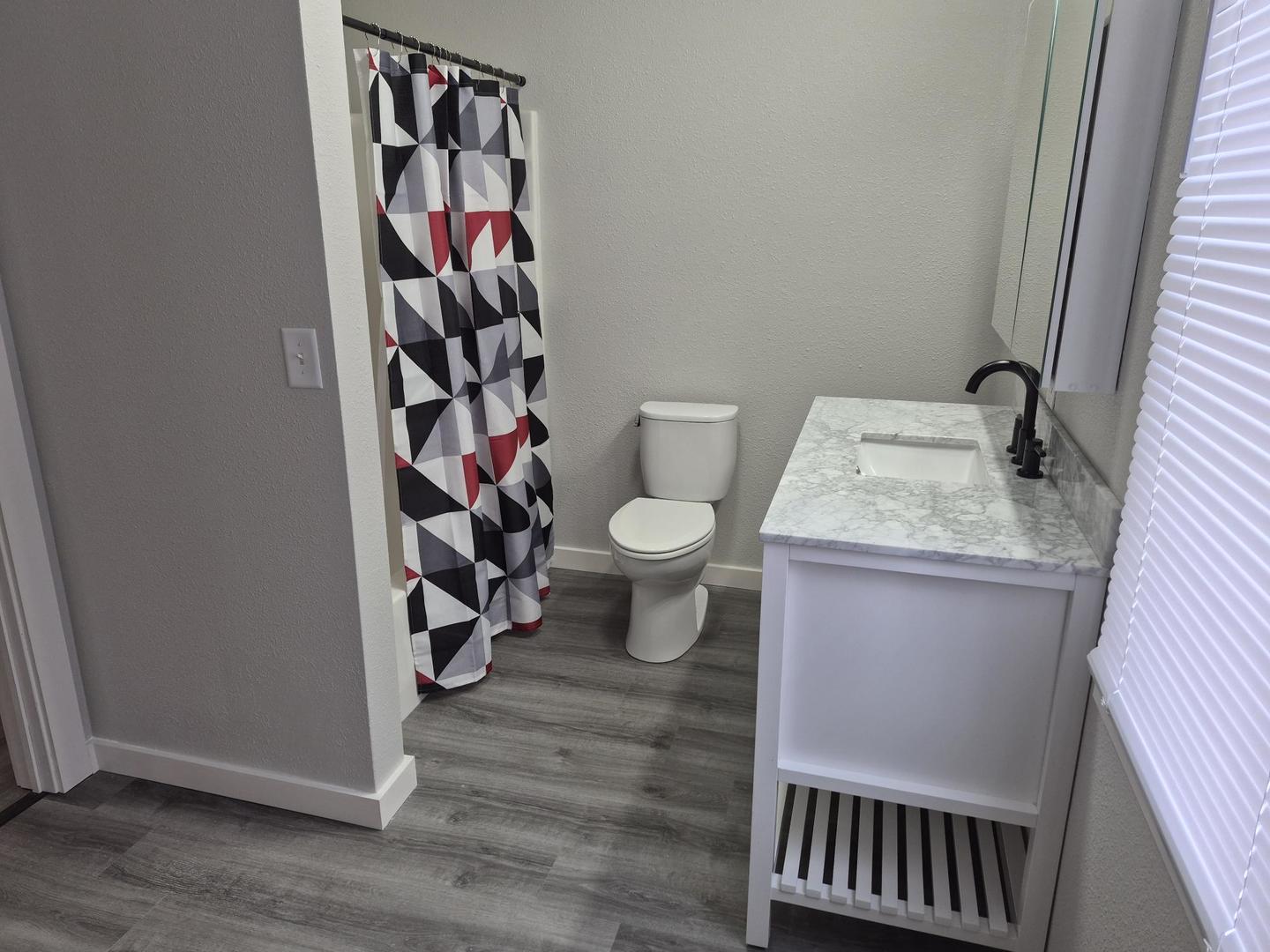 101 North 6th Avenue New Windsor, IL 61465 - Photo 19 of 33 a bathroom with a toilet and a sink