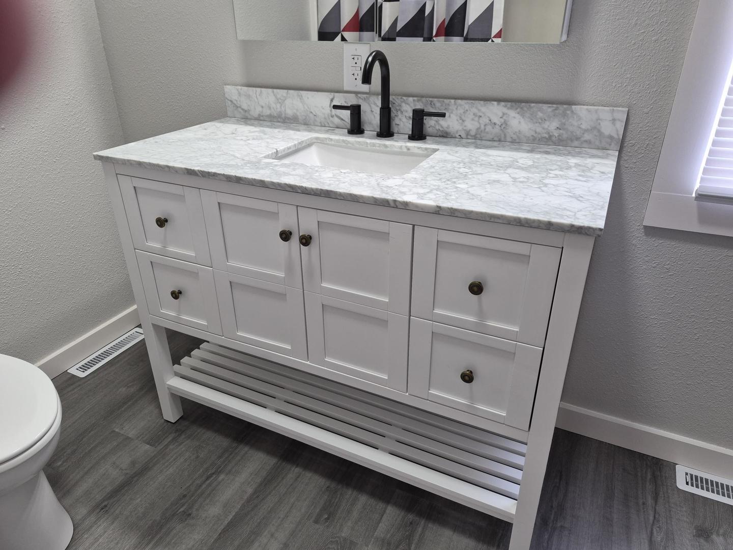 101 North 6th Avenue New Windsor, IL 61465 - Photo 20 of 33 a bathroom with a granite countertop sink toilet and vanity