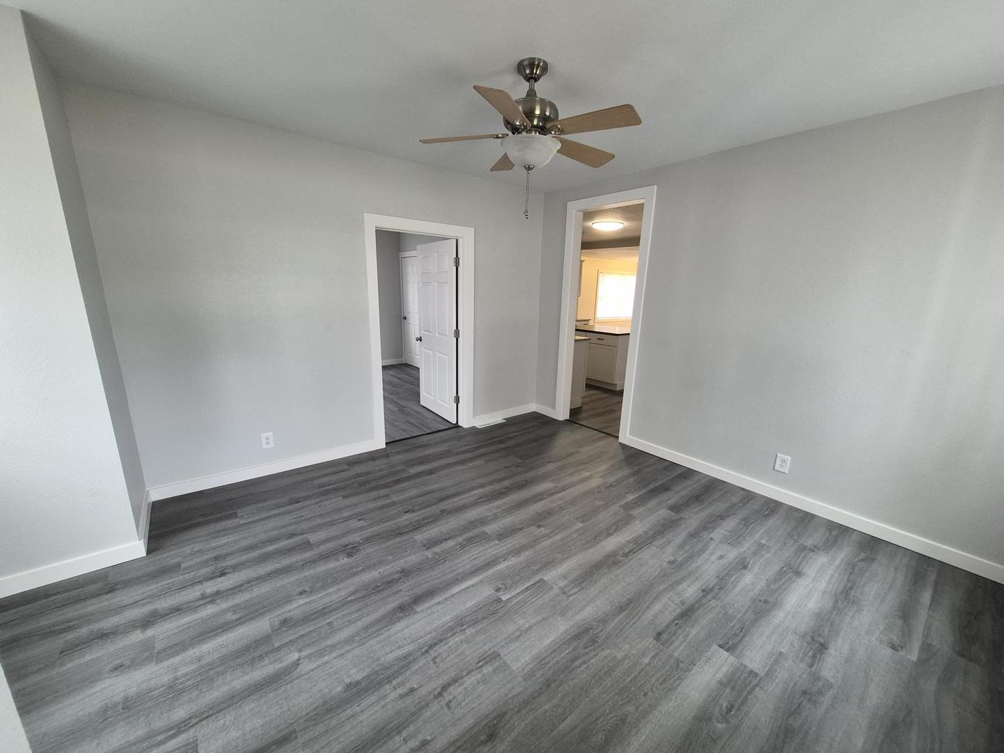 101 North 6th Avenue New Windsor, IL 61465 - Photo 23 of 33 a view of an empty room with wooden floor and a window