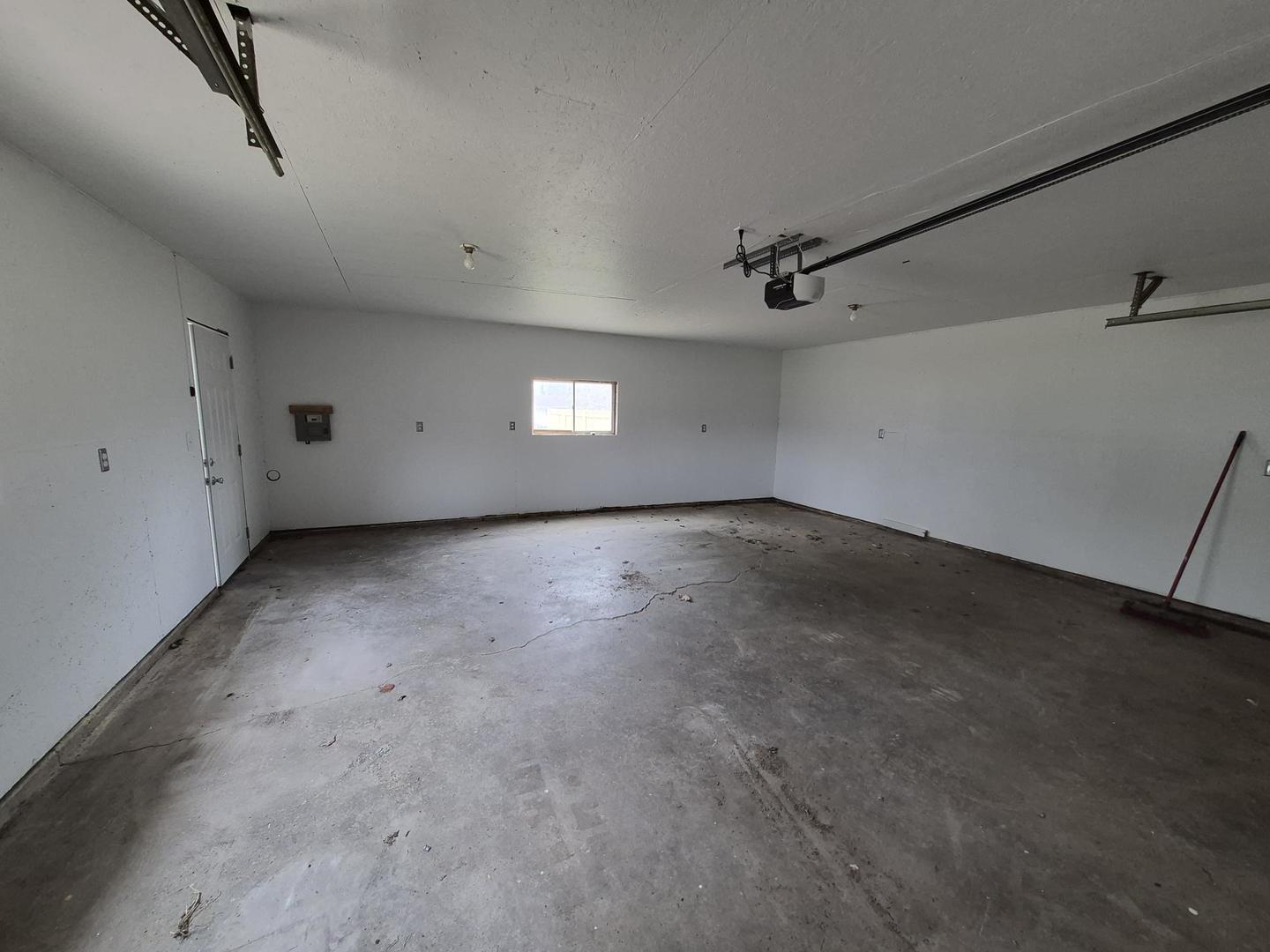 101 North 6th Avenue New Windsor, IL 61465 - Photo 33 of 33 an empty room with a ceiling fan and windows