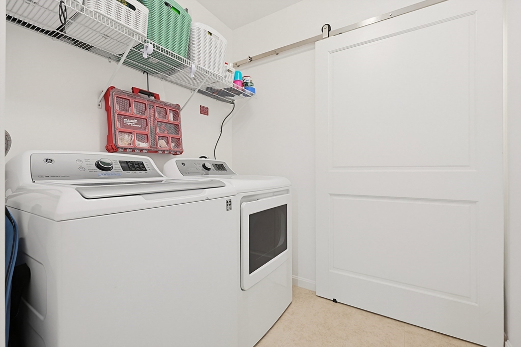 200 Revere Street, Unit 4209 Canton, MA 02021 - Photo 27 of 35 a utility room with dryer and washer