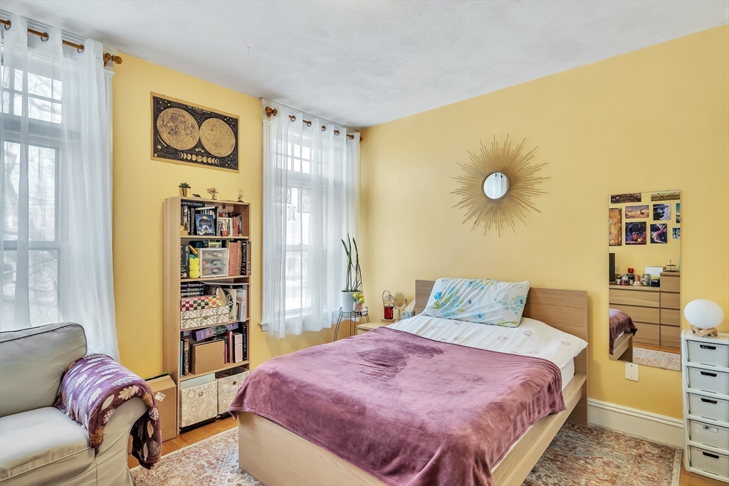 1891 Beacon Street, Unit 2 Brookline, MA 02445 - Photo 17 of 31 a bedroom with a bed and a cabinets