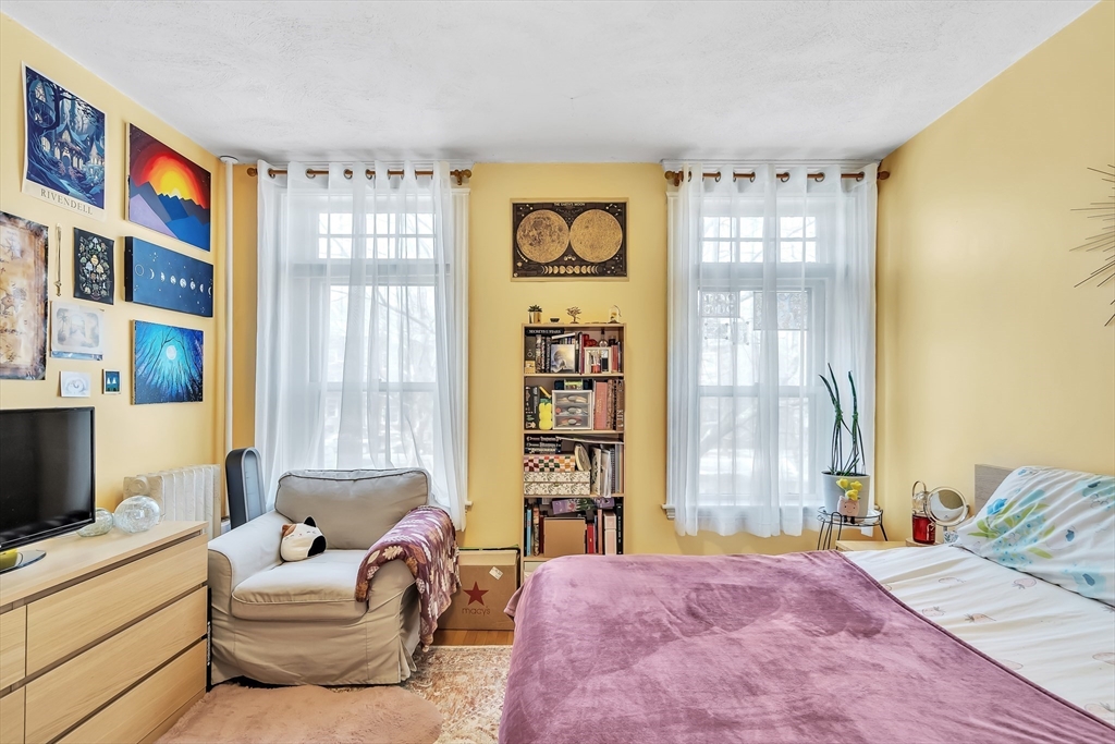 1891 Beacon Street, Unit 2 Brookline, MA 02445 - Photo 18 of 31 a bedroom with a bed furniture and a window