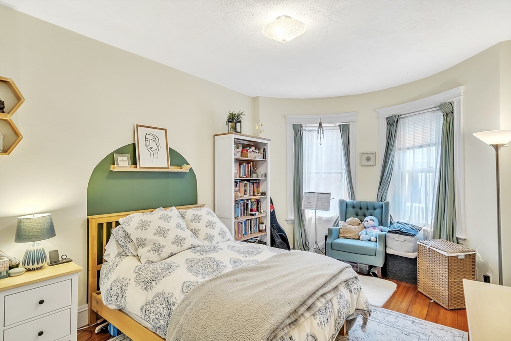 1891 Beacon Street, Unit 2 Brookline, MA 02445 - Photo 21 of 31 a bedroom with a bed and a dresser