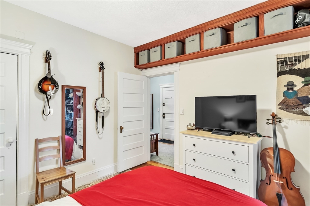 1891 Beacon Street, Unit 2 Brookline, MA 02445 - Photo 25 of 31 a living room with furniture and a flat screen tv