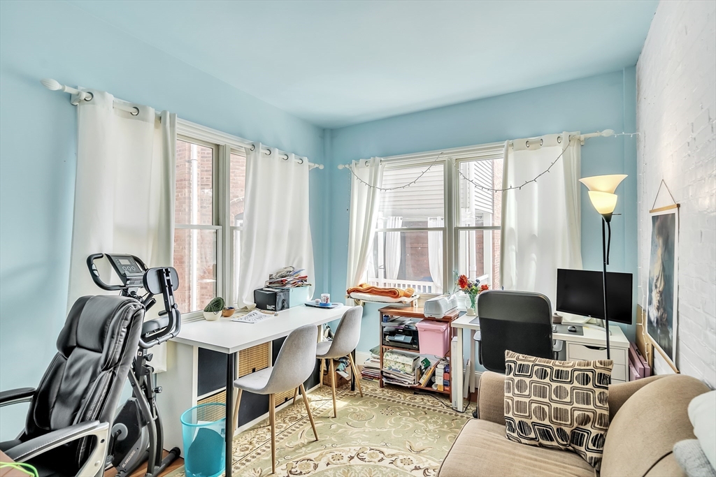1891 Beacon Street, Unit 2 Brookline, MA 02445 - Photo 26 of 31 a living room with furniture and floor to ceiling windows