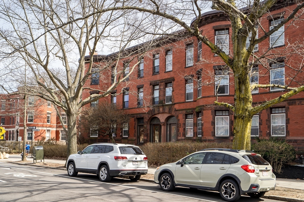 1891 Beacon Street, Unit 2 Brookline, MA 02445 - Photo 29 of 31 a car parked in front of a brick building