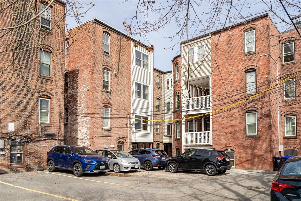 1891 Beacon Street, Unit 2 Brookline, MA 02445 - Photo 30 of 31 a car parked in front of a building