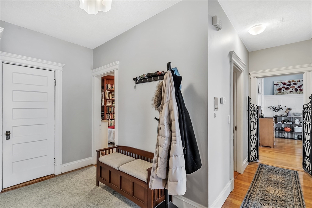 1891 Beacon Street, Unit 2 Brookline, MA 02445 - Photo 3 of 31 a living room with a couch and wooden floor