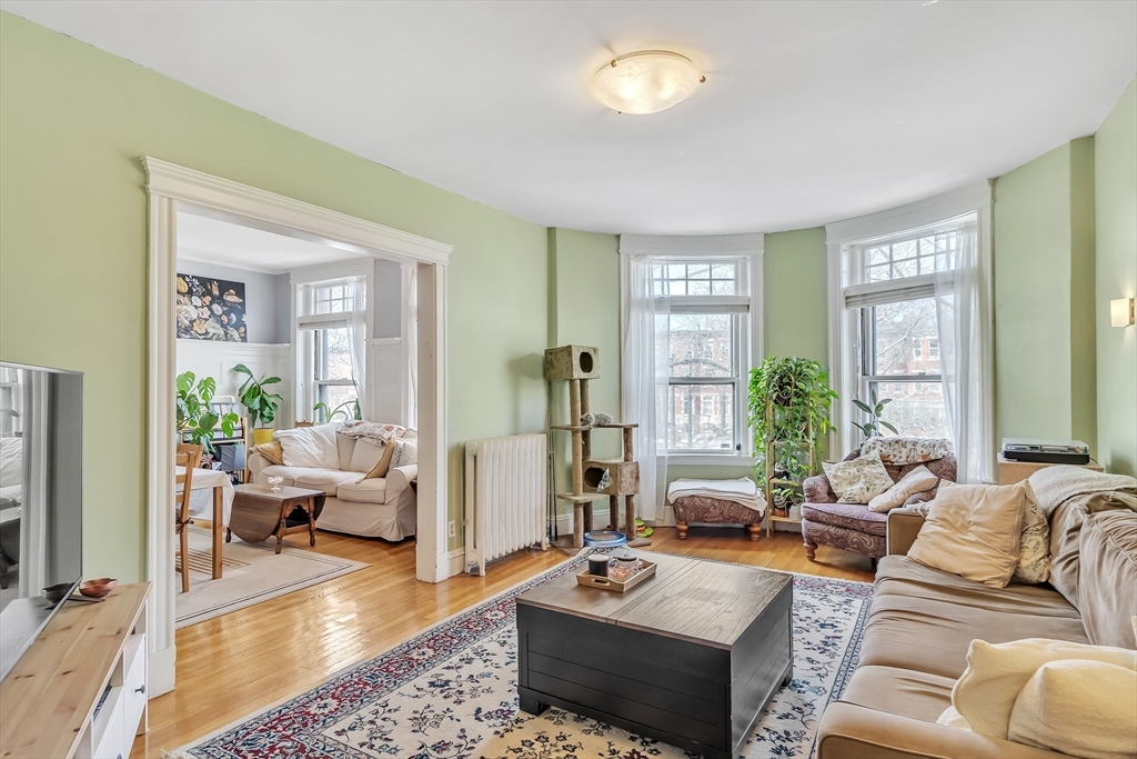 1891 Beacon Street, Unit 2 Brookline, MA 02445 - Photo 4 of 31 a living room with furniture windows and a table