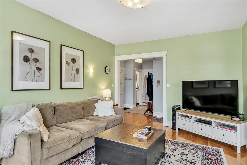 1891 Beacon Street, Unit 2 Brookline, MA 02445 - Photo 6 of 31 a living room with furniture and a flat screen tv