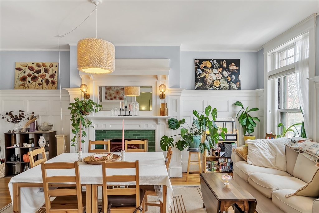 1891 Beacon Street, Unit 2 Brookline, MA 02445 - Photo 8 of 31 a living room with furniture fireplace and a large window