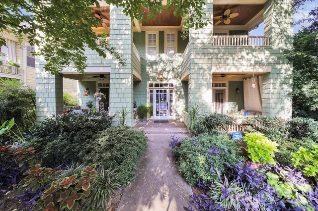 a view of a house with brick walls