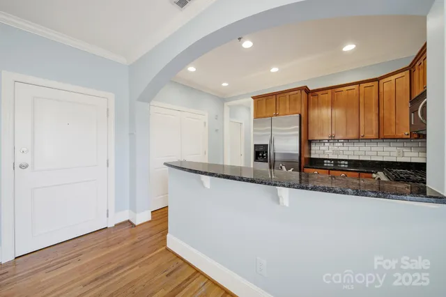 a view of empty room with window and ceiling fan