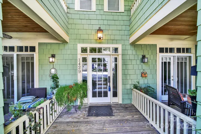 a living room with furniture a table and a window