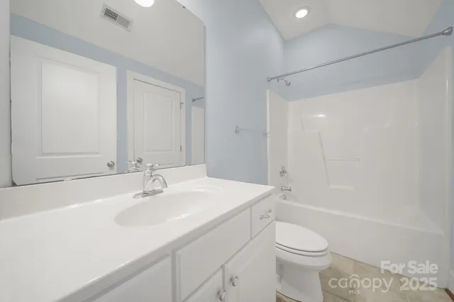 a view of a porch with wooden floor and fence