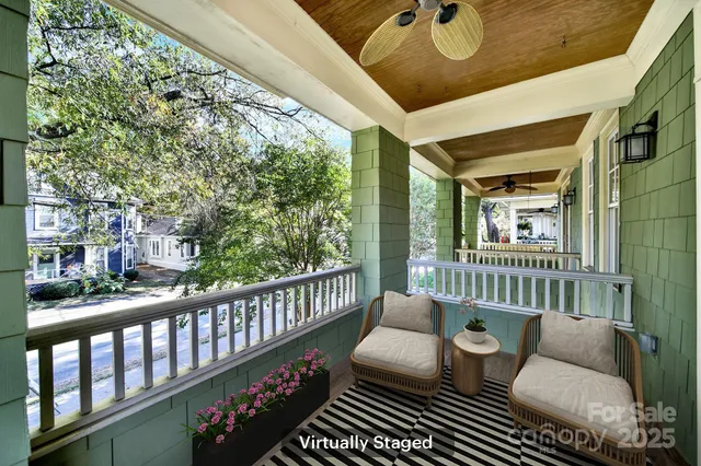 a front view of a house with a yard and tree s