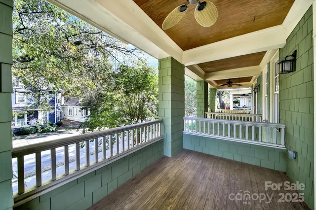 a view of a house with a yard and garage