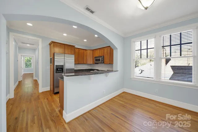 a kitchen with granite countertop a stove and a sink