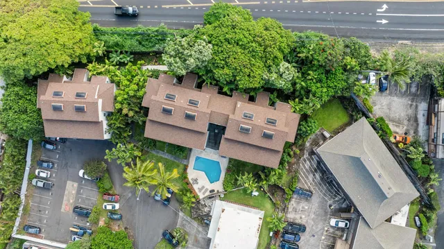 an aerial view of a house with outdoor space and street view