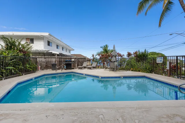 a view of a swimming pool with a patio