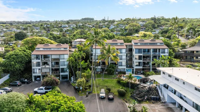 an aerial view of residential houses with outdoor space