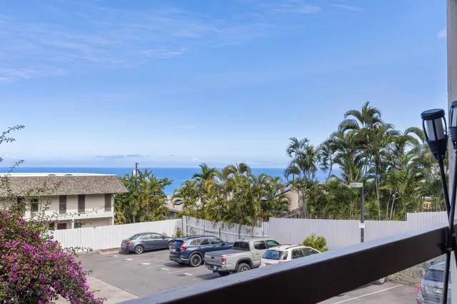 a view of a patio with couches and table and chairs and potted plants