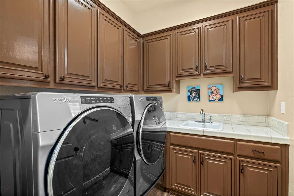 112 Glen View Court Copperopolis, CA 95228 - Photo 41 of 95 Sink and lots of cabinets in laundry room