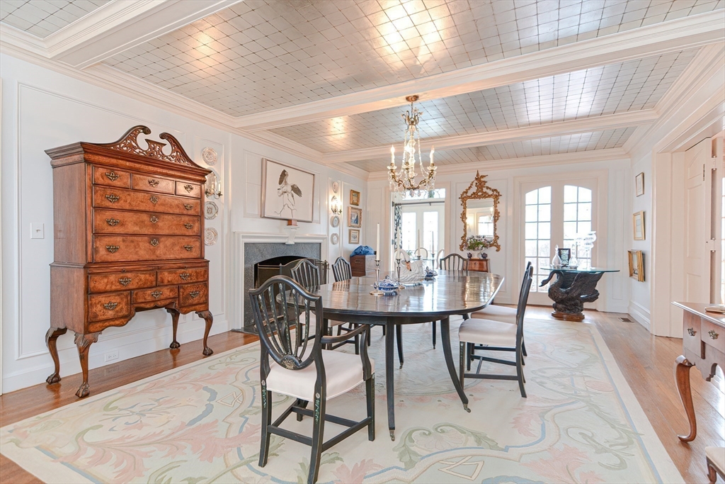 33 Way Road Gloucester, MA 01930 - Photo 16 of 38 a view of a dining room with furniture and a chandelier