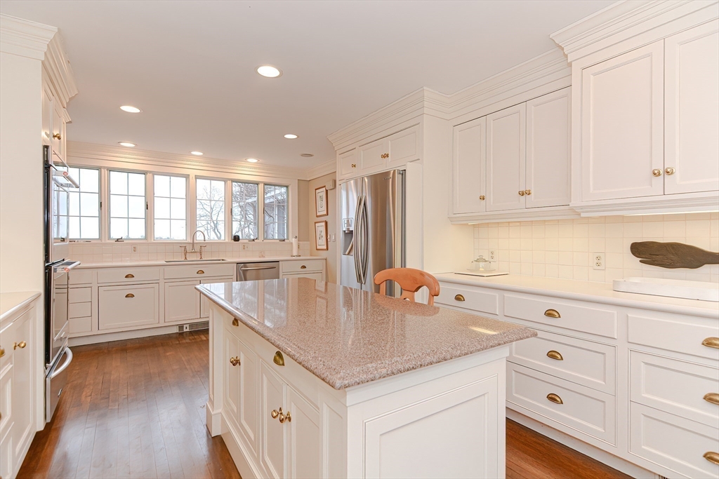 33 Way Road Gloucester, MA 01930 - Photo 20 of 38 a kitchen with stainless steel appliances granite countertop a sink stove and cabinets