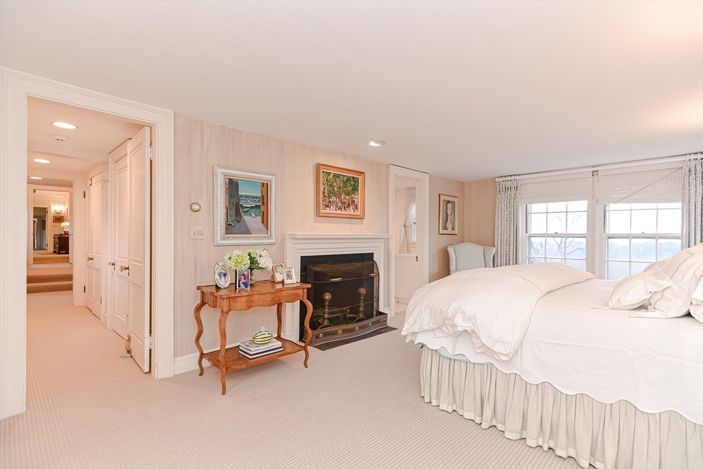 33 Way Road Gloucester, MA 01930 - Photo 29 of 38 a bedroom with a bed and a fireplace