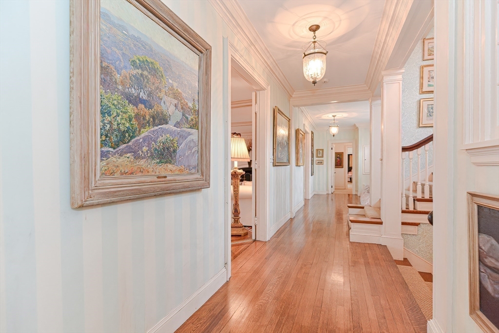 33 Way Road Gloucester, MA 01930 - Photo 8 of 38 a view of a hallway with wooden floor and a living room