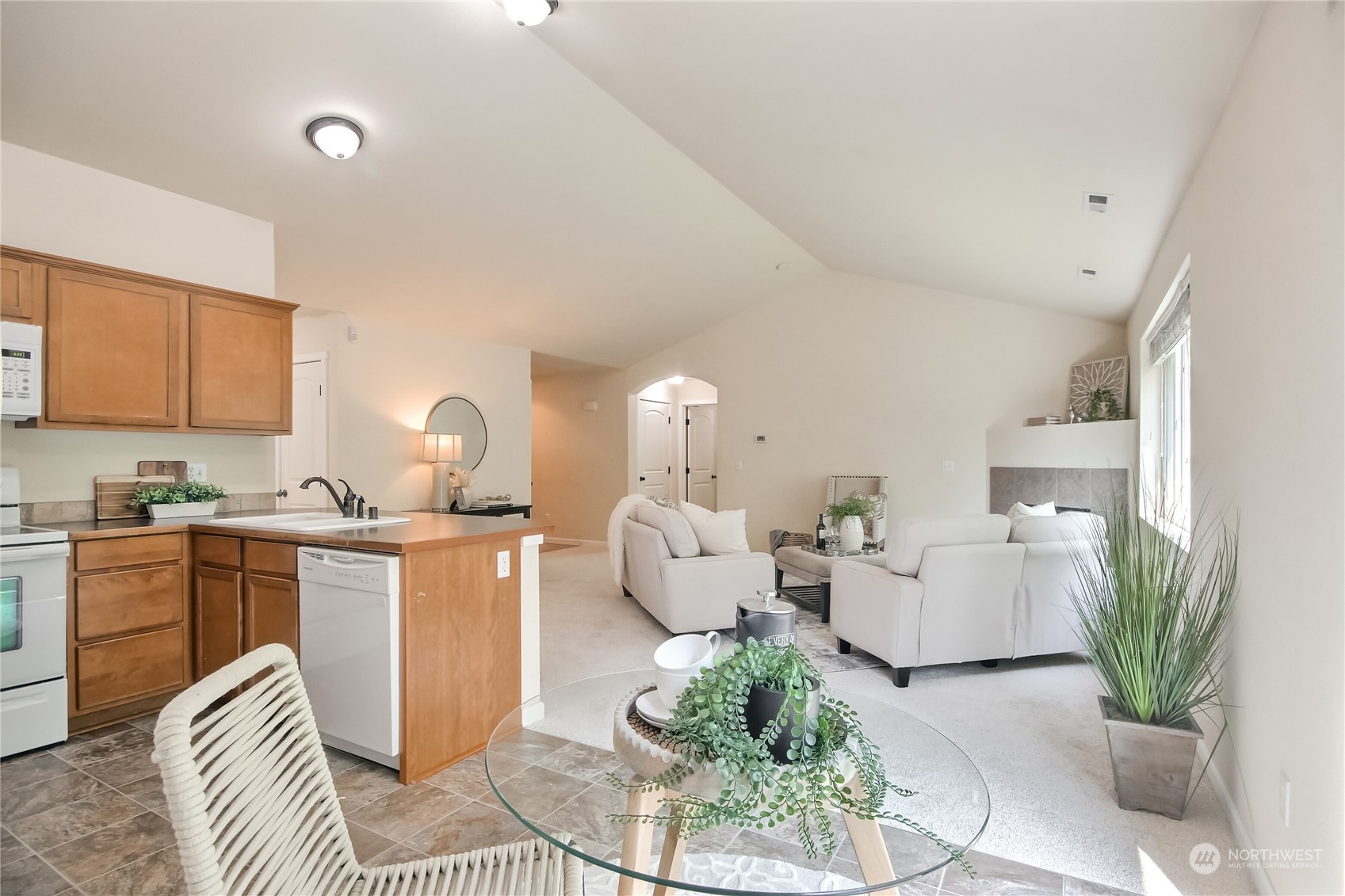 9814 201st Street East Graham, WA 98338 - Photo 14 of 40 a living room with furniture and a kitchen