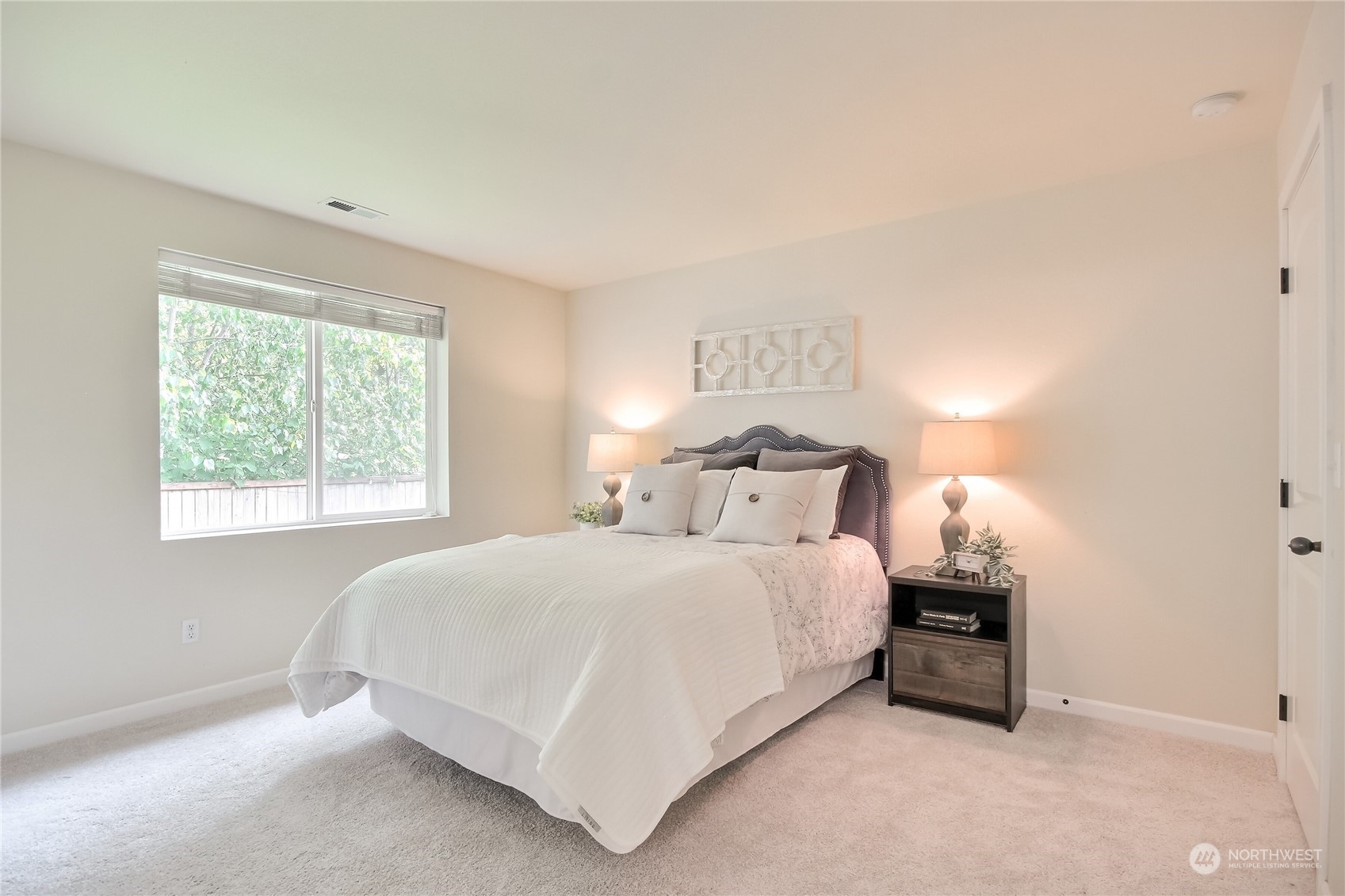 9814 201st Street East Graham, WA 98338 - Photo 17 of 40 a bedroom with a bed and a window