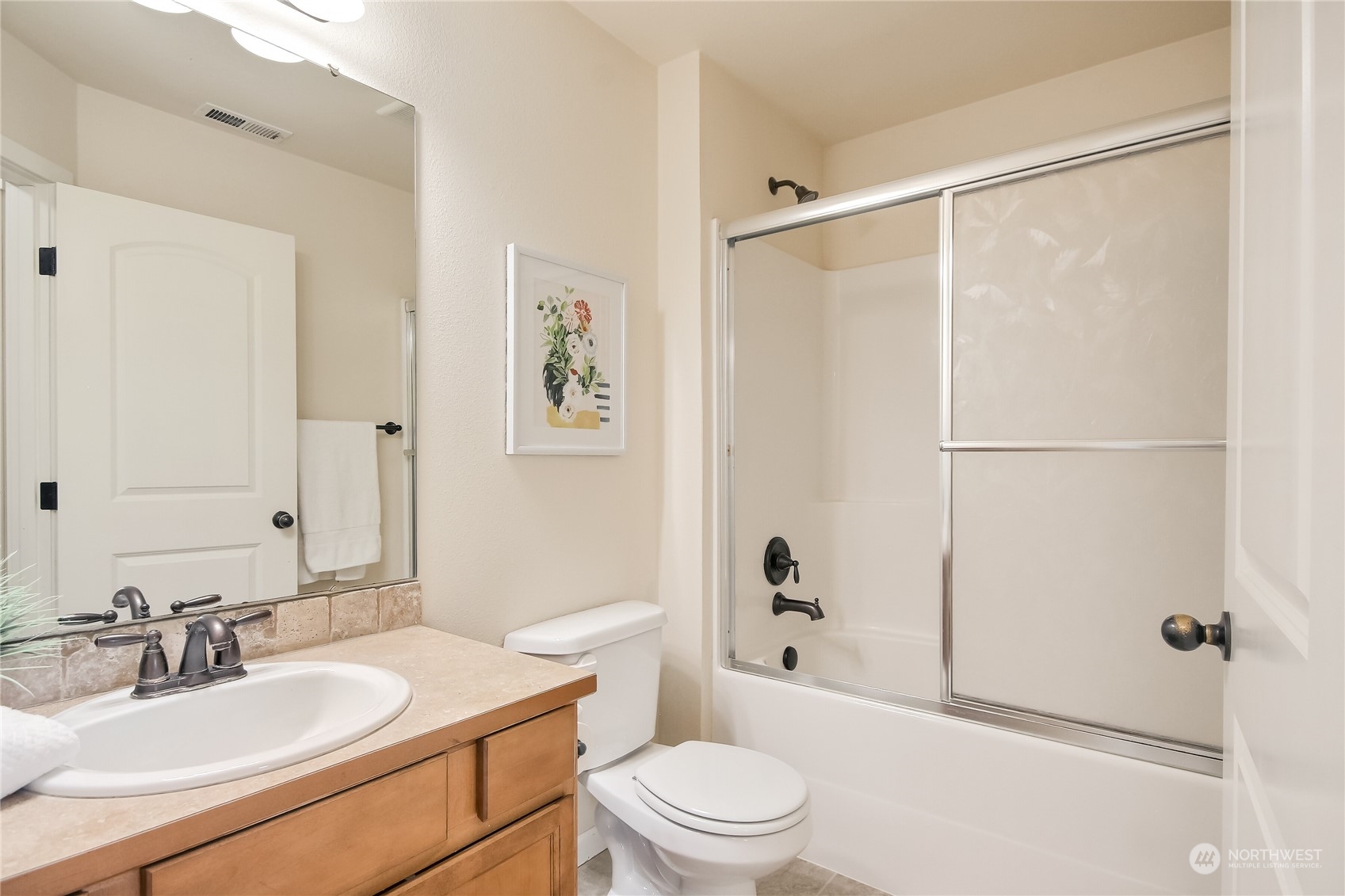 9814 201st Street East Graham, WA 98338 - Photo 19 of 40 a bathroom with a sink toilet and shower
