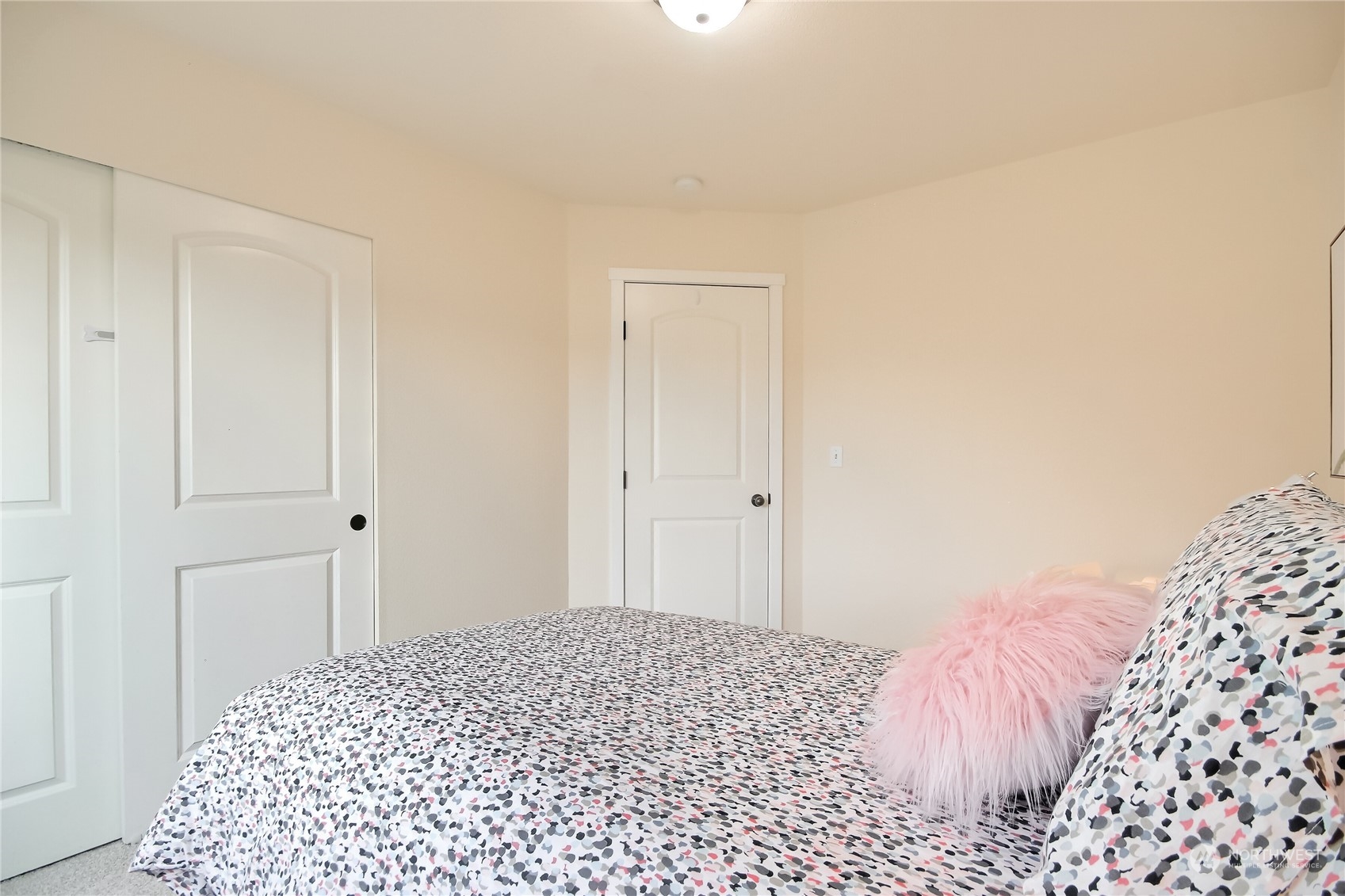 9814 201st Street East Graham, WA 98338 - Photo 23 of 40 a bedroom with a bed and a rug