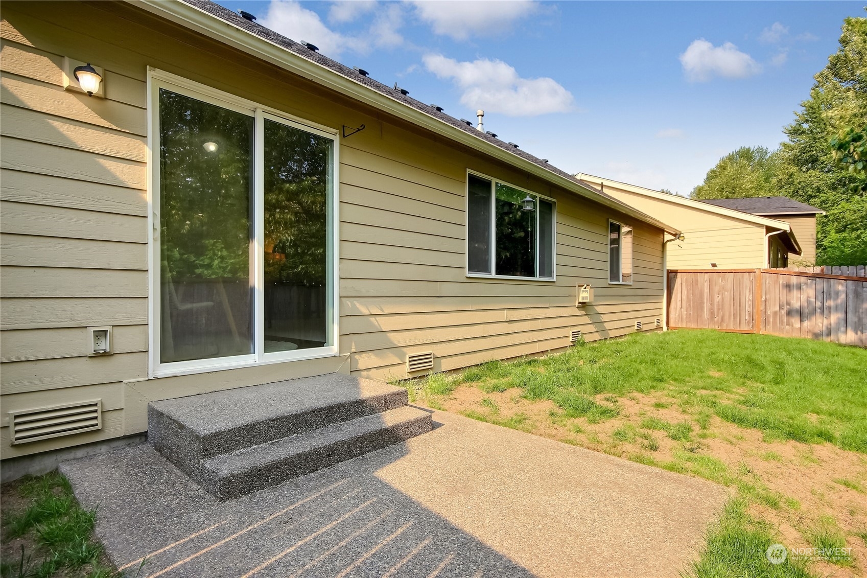 9814 201st Street East Graham, WA 98338 - Photo 25 of 40 a front view of a house with garden